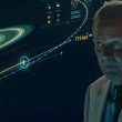 the professor lectures as the background shows the mission to titan